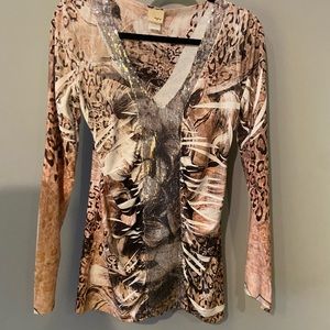 Animal print shirt with silver sequins and rushing in the front front.